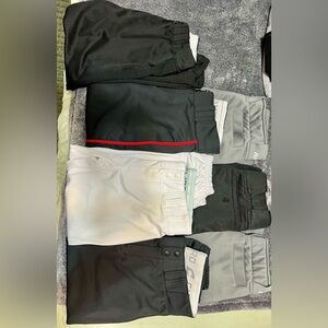 Softball pants. Brands like Champro and Mizuno. Size S/M Softball belts & socks.